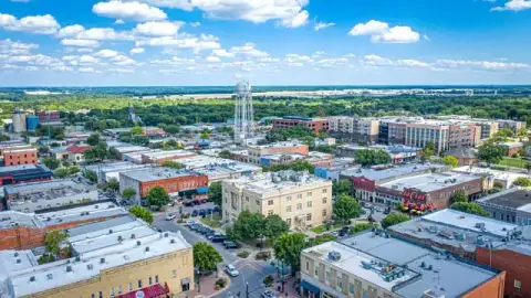 Historic downtown McKinney square with the former courthouse and water tower.